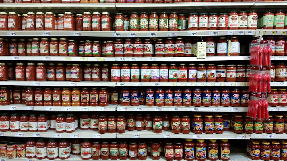 In a sea of pasta sauces at the grocery store. Only two kinds were compliant. All the other ones had added sugar.