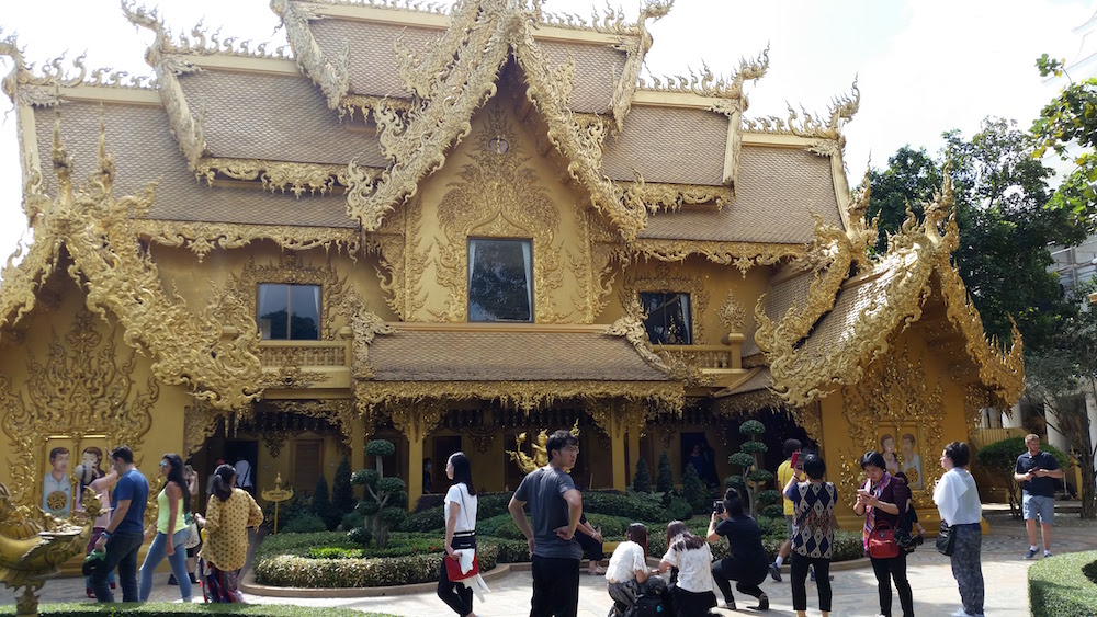 white-temple-golden-toilet